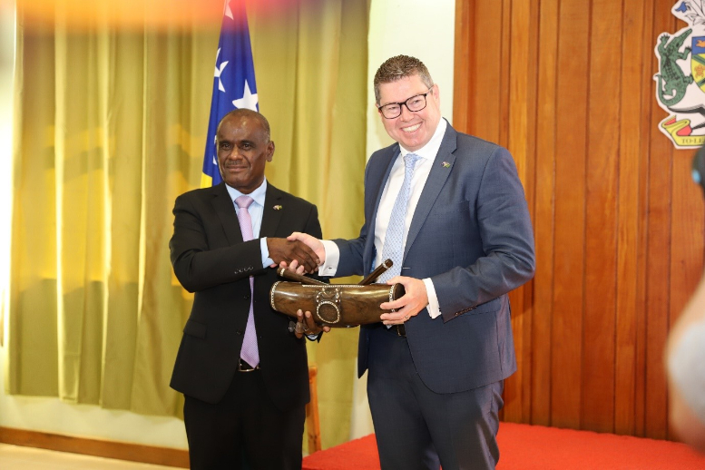 Minister for Foreign Affairs and External Trade Hon. Jeremiah Manele, presenting a gift to the Australian Minister for International Development and the Pacific, and the Minister for Defence Industry, Hon. Pat Conroy