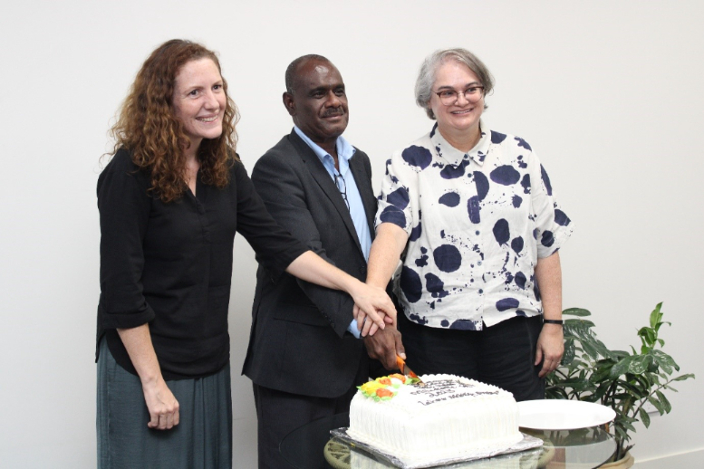 Minister of Foreign Affairs and External Trade, Hon. Jeremiah Manele cutting the milestone cake with Deputy High Commissioner of Australia, Sally Anne Vincent (Right) and New Zealand Deputy High Commissioner to Solomon Islands, Kate Bradlow.